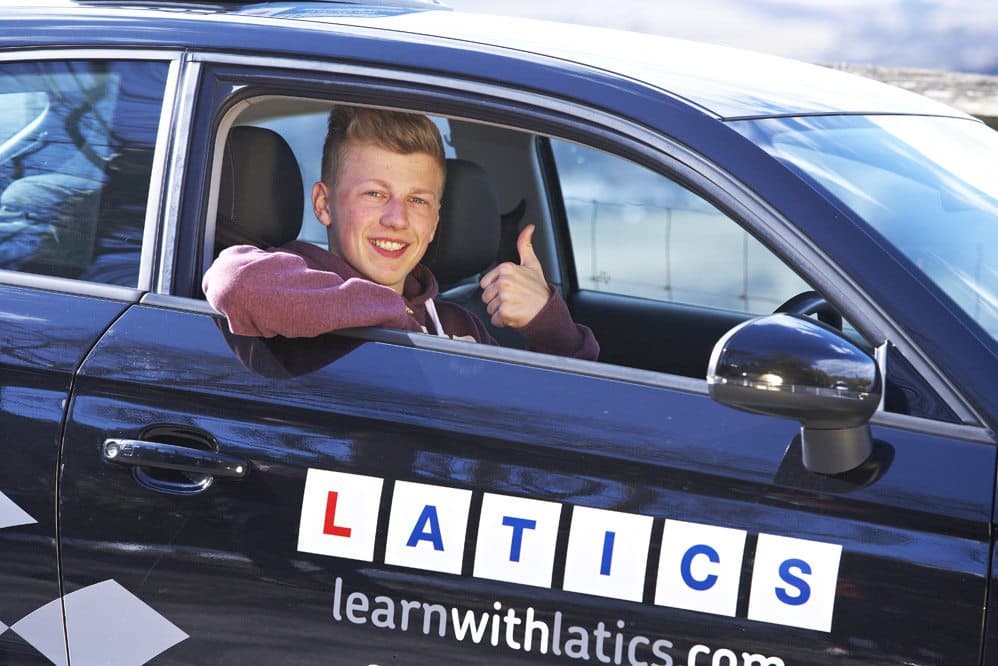 Learner driver smiling in a Latics Driver Training automatic lesson car